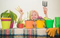 Funny young woman gardening. Watering flowers. Gardener woman planting flowers. Cute blonde gardening at isolated