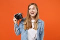 Funny young woman girl in casual denim clothes posing isolated on orange background studio portrait. People sincere Royalty Free Stock Photo