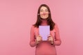 Funny young woman having fun holding pencil with lip and nose, female student resting during hometask doing Royalty Free Stock Photo