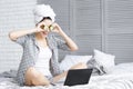 Funny young woman after shower using laptop. Skin care concept Royalty Free Stock Photo