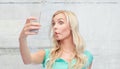 Funny young woman taking selfie with smartphone Royalty Free Stock Photo