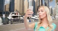 Funny young woman taking selfie with smartphone Royalty Free Stock Photo