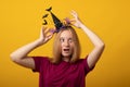 Funny young woman wearing witch costume for Halloween party. Happy Halloween Royalty Free Stock Photo