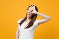 Funny young woman in white casual clothes holding hands near eyes, imitating glasses or binoculars isolated on bright Royalty Free Stock Photo