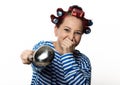 Funy housewife with curlers hold vintage iron and a ladle. free space for your text