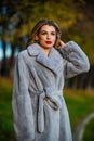 Fur boutique. Sexy woman red lips wear fur coat. Businesswoman in fur coat. Simple and warm. Glamorous lady. Cosy autumn Royalty Free Stock Photo