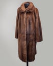 Fur coat of mink light brown with decorative collar straight cut with undercut on the yoke