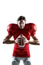 Furious American football player in red jersey holding ball Royalty Free Stock Photo