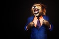 Furious angry businessman with face of lion roar