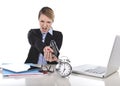 Furious angry businesswoman working pointing gun to alarm clock in out of time concept Royalty Free Stock Photo