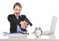 Furious angry businesswoman working pointing gun to alarm clock in out of time concept Royalty Free Stock Photo