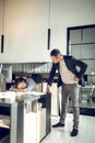 Furious boss looking at his secretary sleeping on the table Royalty Free Stock Photo