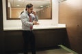 Furious Business Man Screaming On Cell Phone In Office Restroom Royalty Free Stock Photo