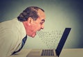 Furious business man working on computer, screaming Royalty Free Stock Photo
