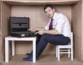 Furious businessman points to an empty briefcase Royalty Free Stock Photo