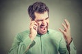 Furious businessman screaming on the phone Royalty Free Stock Photo