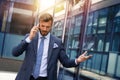 Furious businessman talking to someone over smart phone Royalty Free Stock Photo