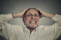 Furious frustrated elderly man having hard day Royalty Free Stock Photo