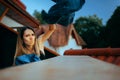 Furious Girlfriend Throwing Boyfriend Clothes Over the Balcony