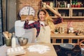 Furious housewife with frying pan and rolling pin Royalty Free Stock Photo