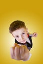 Furious little boy pointing with fist