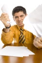 Furious man crumpling papers Royalty Free Stock Photo