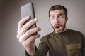 Furious man yelling at his phone Royalty Free Stock Photo