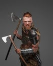 Furious viking with red hairs in combat stance