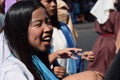 Furious woman persecuting Jesus Christ cheering, ridiculing amidst crowd, street drama, community celebrates Good Friday represent