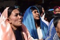 Furious woman persecuting Jesus Christ cheering, ridiculing amidst crowd, street drama, community celebrates Good Friday represent