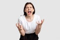 Furious woman portrait nervous breakdown yelling