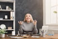 Furious woman working on laptop at office