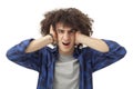 Furious young man covering ears with hands Royalty Free Stock Photo