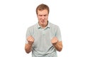 Furious young man in mint T-shirt ready to fight with fists isolated on white background Royalty Free Stock Photo