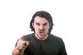 Furious young man pointing forefinger to camera blaming someone as guilty, or scolding isolated on white background. Angry guy Royalty Free Stock Photo