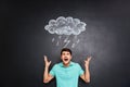 Furious young man yelling over background of chalkboard Royalty Free Stock Photo