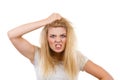 Furiously mad angry blonde woman holding hair Royalty Free Stock Photo