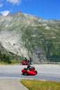 Furka Pass, Switzerland - July 04, 2022: Red scooters in Furka Pass - the canton of Valais, Switzerland, Europe Royalty Free Stock Photo