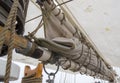 Furled sail on a boom on a tall ship