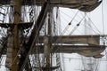 Furled sails and rigging on a tall ship Royalty Free Stock Photo