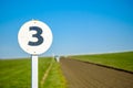 3 furlong distance marker seen on the edge of a professional Royalty Free Stock Photo