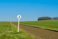 2 furlong distance marker seen on the edge of a professional flat-racing training track. Royalty Free Stock Photo
