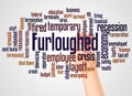 Furloughed word cloud and hand with marker concept Royalty Free Stock Photo