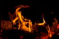 In the furnace a bright fire burns, it`s nice to sit by the hearth Royalty Free Stock Photo