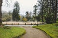 Furnas, Azores, Portugal - Jan 13, 2020: Hot spring iron water thermal pool in Terra Nostra Garden. The pool is surrounded by