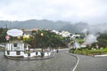 Furnas, Azores, Portugal - Jan 13, 2020: Village street by volcanic hot springs in Portuguese Furnas. Geothermal sulfur spring.