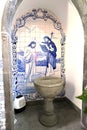 Furnas, Azores - 23rd April 2019:Local tiles and font in the church of Igreja de Saint Nicolau