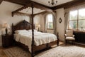 Furnished bedroom within former victorian rectory with ornate carved four poster bed and matching period sideboard drawers, chaise