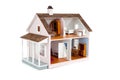 Furnished pink doll house on white