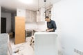 furniture assembly - worker installing cabinet shelf Royalty Free Stock Photo